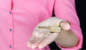 a pink lady holding a key